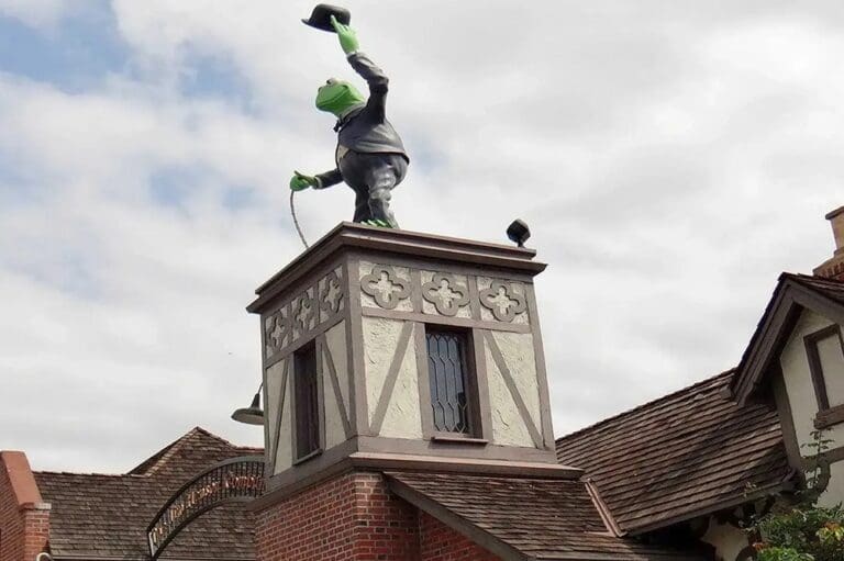 A statue of a man on top of a building.