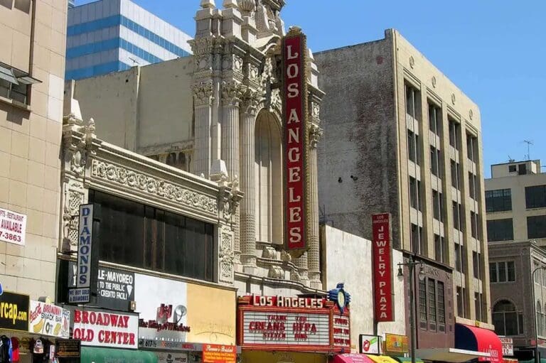 A theater sign on the side of a building.