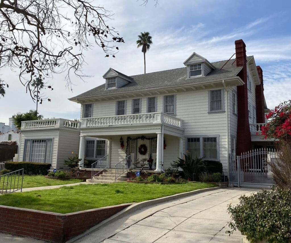 Two-story white colonial house with porch