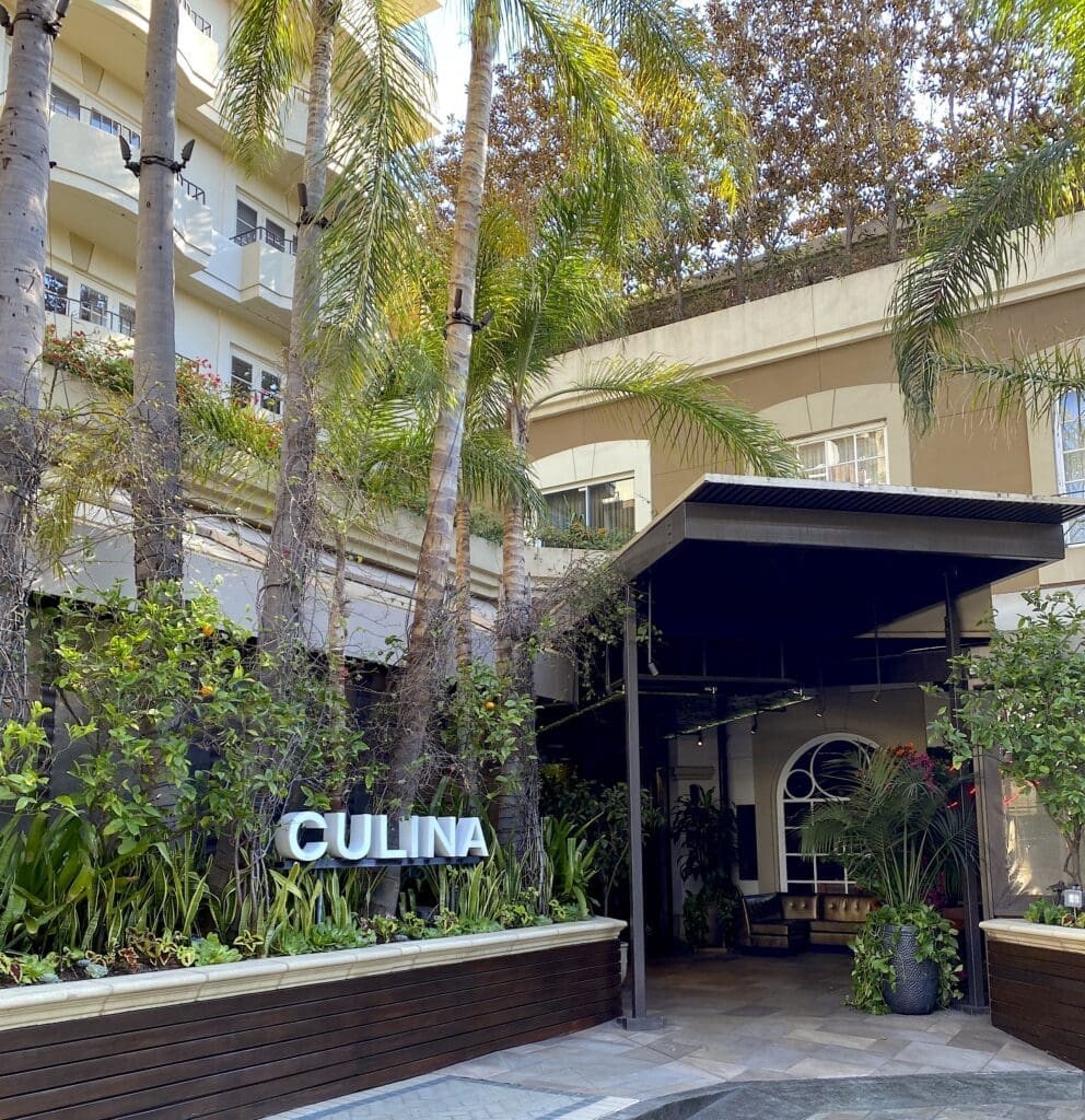 Culina restaurant entrance with palm trees