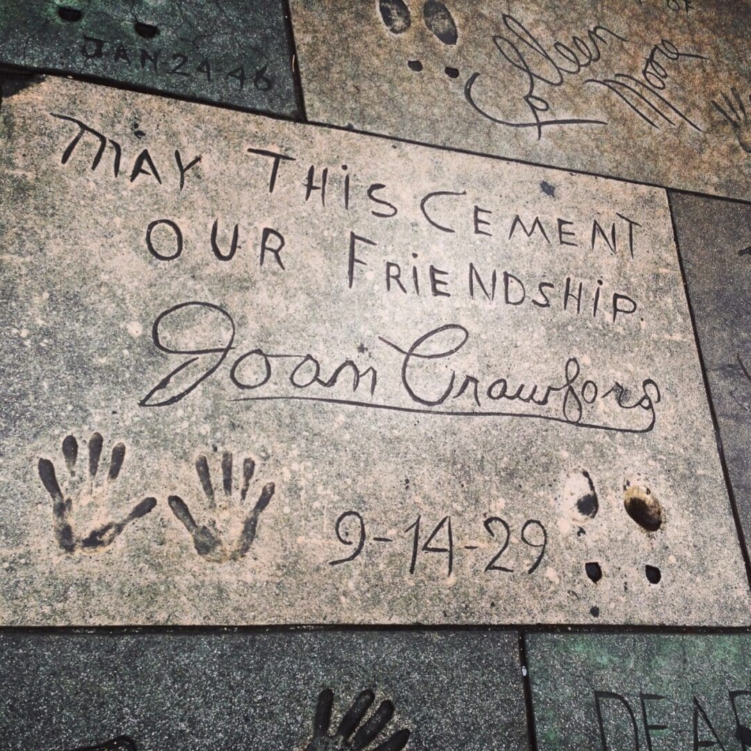 Joan Crawford's handprints and signature.