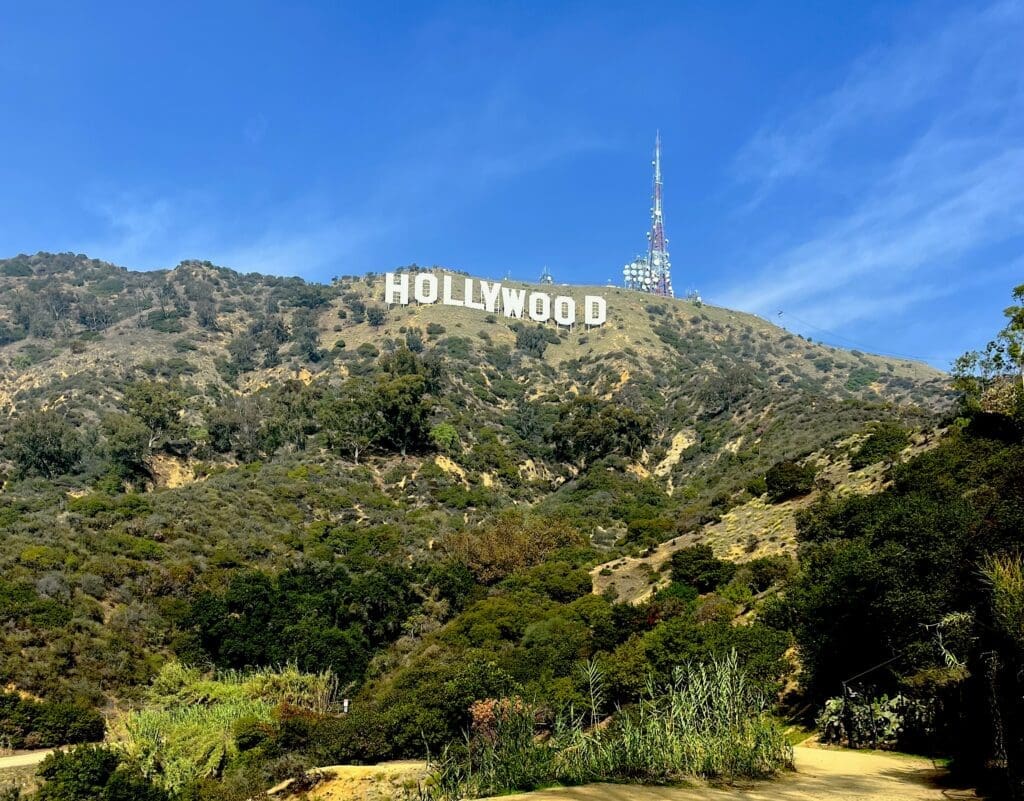 Hollywood sign on hillside with blue sky