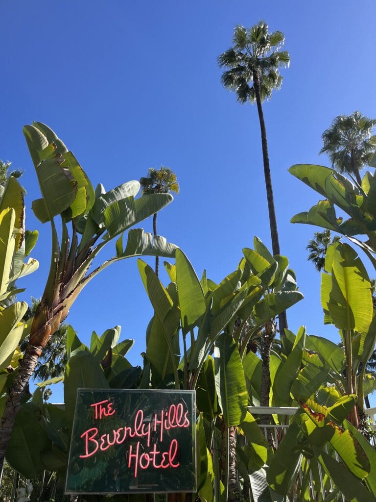 The iconic pink exterior of The Beverly Hills Hotel – A premier destination for Tour Du Jour’s private luxury excursions.