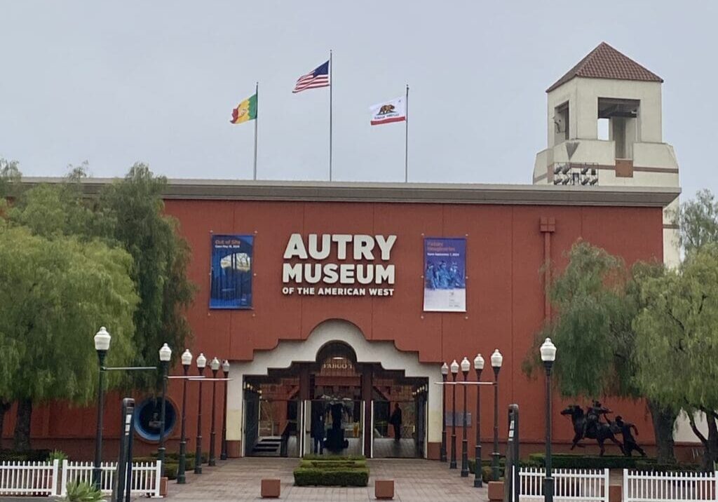 Autry Museum entrance with flags and tower