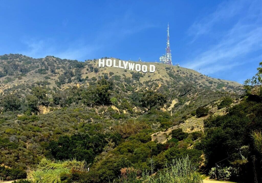Hollywood sign on hillside with blue sky