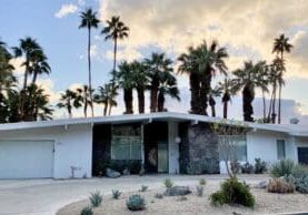 Mid-century modern house, palm trees.